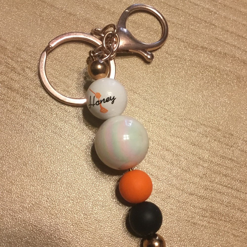 Beaded Keychain with Orange and Black Accents